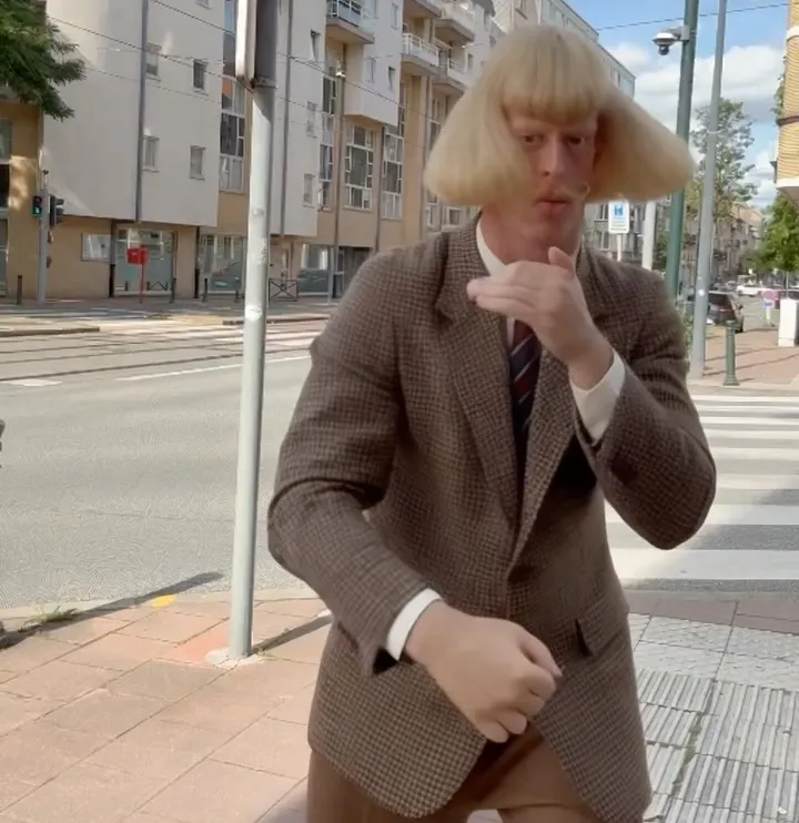 Jean-Phil shadowboxing on a sidewalk